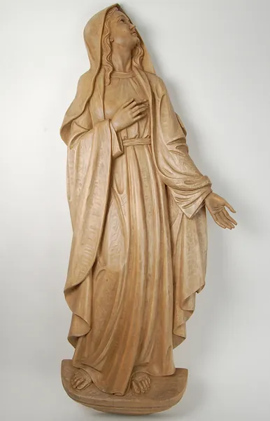 Bas-relief of Our Lady of Sorrows after the treatment with mordant (stain)