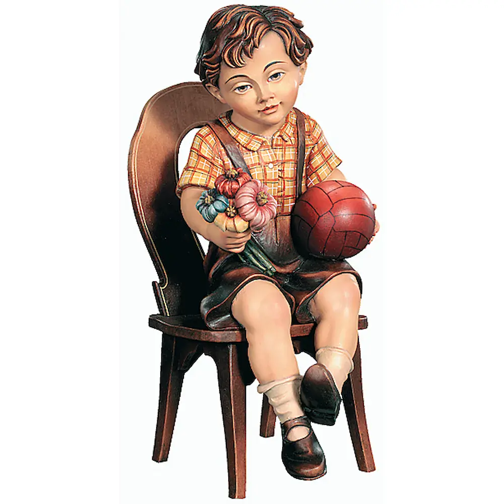 Sitting boy with ball