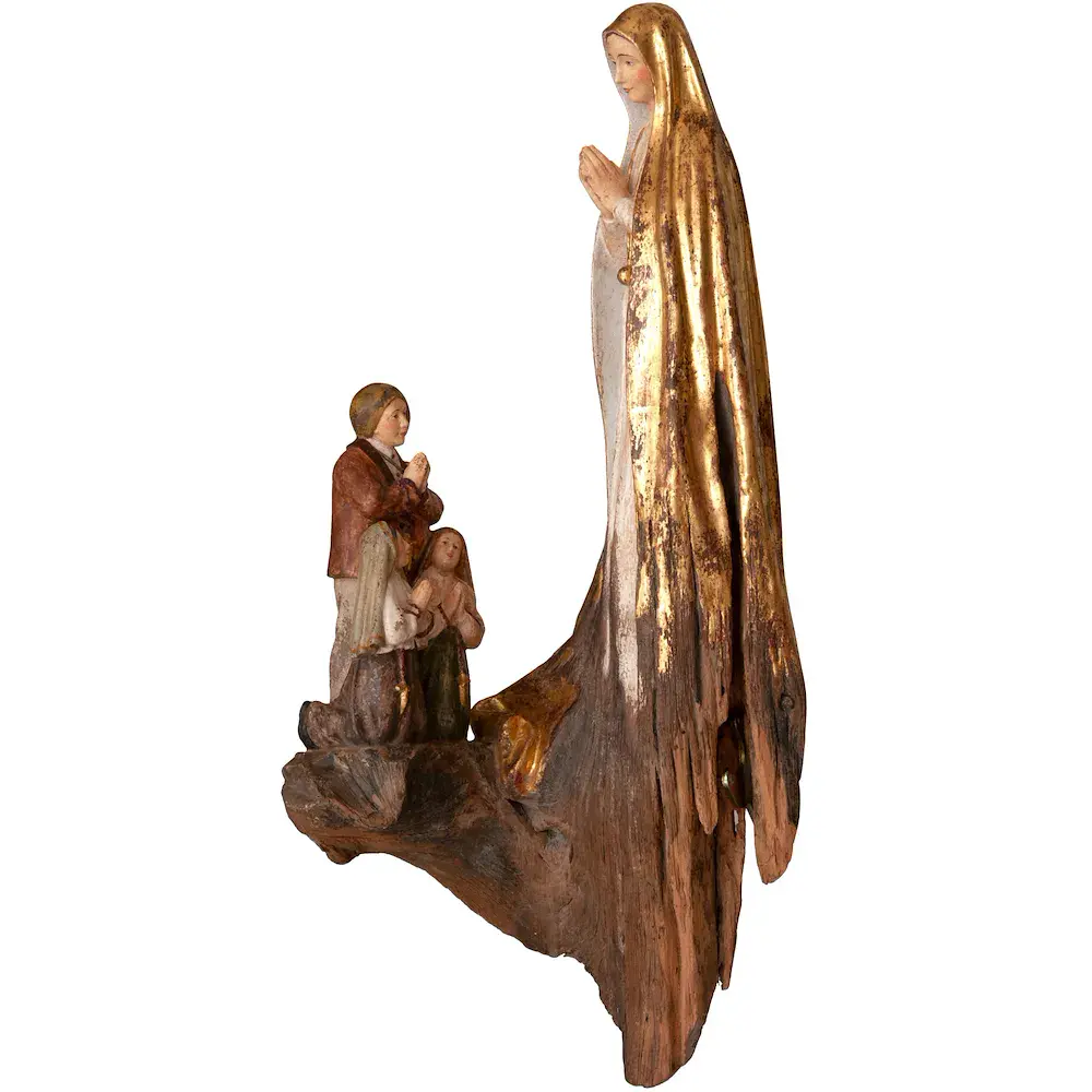 Fatima with children root sculpture